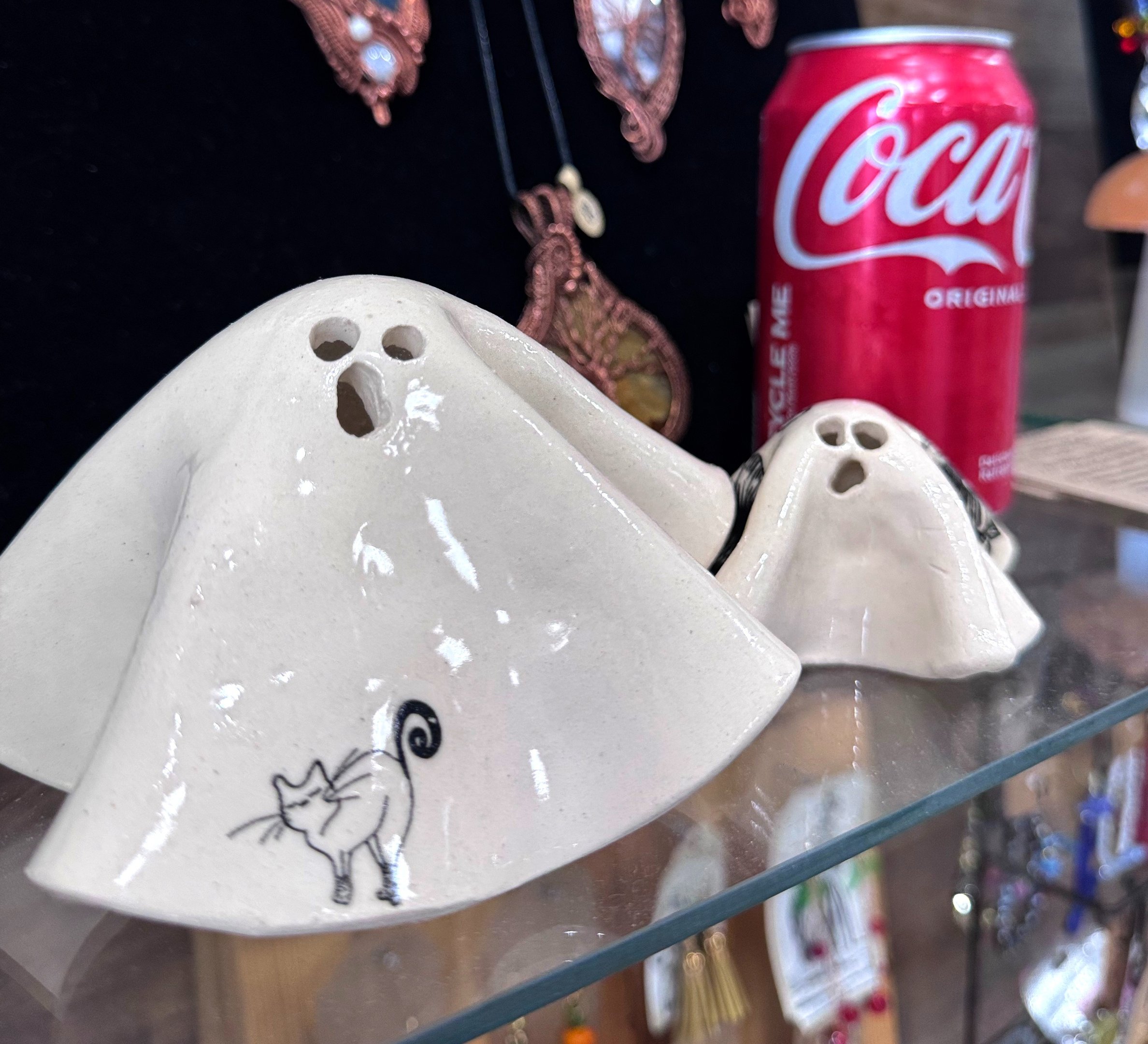 Two ceramic ghosts with underglaze patterns